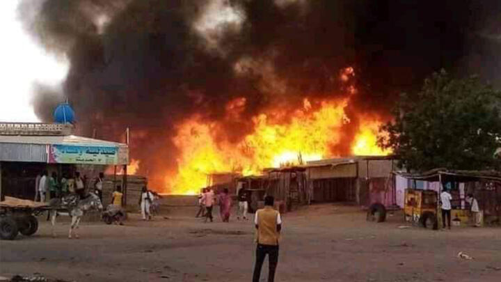 A fire rages in a livestock market area in al-Fasher, the capital of Sudan's North Darfur state, on September 1, 2023, in the aftermath of bombardment by the paramilitary Rapid Support Forces (RSF).