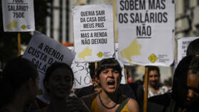 A protester shouts holding a sign reading “I want to leave my parents’ house but the rent didn’t let me” at a demonstration for better housing conditions in Lisbon, Portugal, on September 30, 2023.