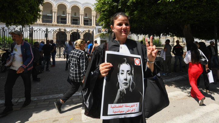 Lawyers rally in front of the Tunis Court on May 13, 2024 as the Tunisian bar association declared a strike  to protest against security forces premises to arrest Sonia Dahmani on May 11.