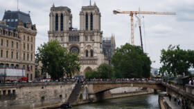Crowds gather near Notre Dame Cathedral in central Paris, on July 14, 2024.