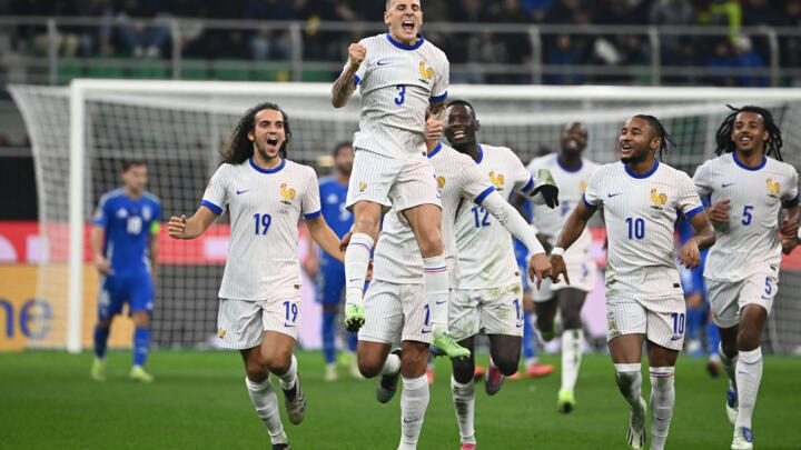 France's defender #03 Lucas Digne celebrates after scoring a goal during the Nations League group A2 football match between Italy and France at San Siro stadium in Milan, November 17, 2024. 