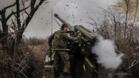 A Ukrainian serviceman of the 24th Mechanized Brigade fires a 2s5 152 mm self-propelled howitzer towards Russian positions at an undisclosed location near Chasiv Yar in Donetsk region on November 18, 