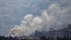This picture taken from a position in northern Israel on the border with Lebanon shows smoke billowing over the village of Meiss El-Jabal on November 28, 2024.