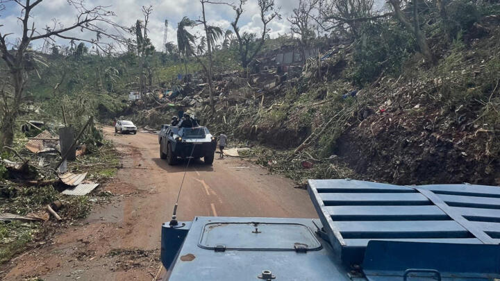French gendarmes are in an armoured vehicle Berliet VXB-170 (or VBRG) driving along a road during a rescue an emergency operation at an undisclosed location in Mayotte. 