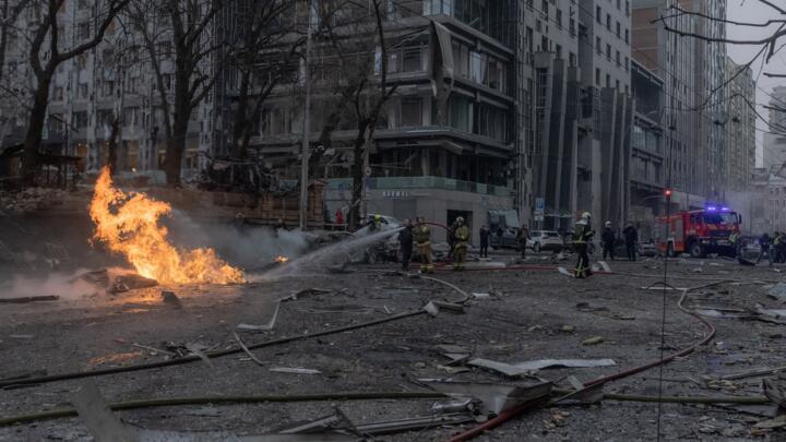 Ukrainian firefighters try to extinguish a fire on the site of a Russian missile attack in Kyiv on December 20, 2024.