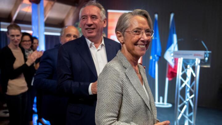French president of Modem Francois Bayrou (CL) and French Prime Minister Elisabeth Borne attend the the Parliamentary days of the Modem party in Guidel, western France, on September 22, 2022.
