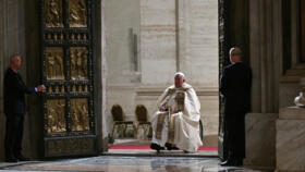 Pope Francis opens the Holy Door of St Peter's Basilica in the Vatican to mark the start of the Catholic Jubilee Year, on December 24, 2024.