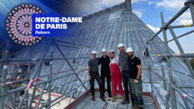 From left to right: glass painters Stephan Lübbers, Felix Busse, Elodie Schneider, Stefan Lücking and Sascha Aretz stand atop Notre-Dame.