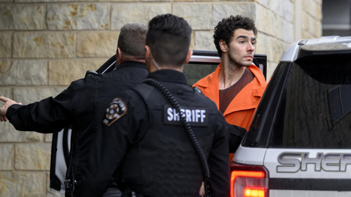 Suspected shooter Luigi Mangione is led into the Blair County Courthouse for an extradition hearing December 10, 2024 in Hollidaysburg, Pennsylvania. 