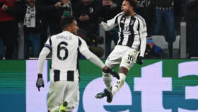 Weston McKennie (R) celebrates after scoring to give Juventus a 2-0 lead against Manchester City in Turin