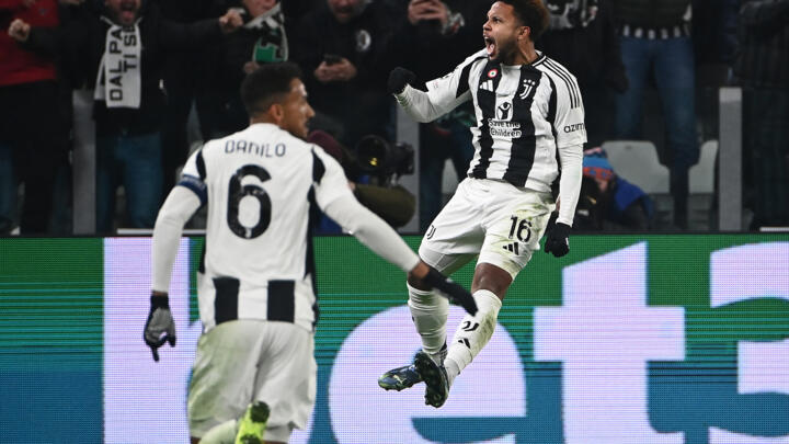 Weston McKennie (R) celebrates after scoring to give Juventus a 2-0 lead against Manchester City in Turin