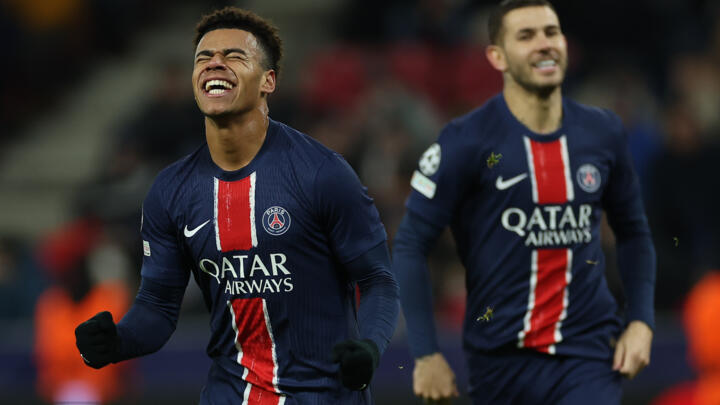 PSG's French midfielder Desiré Doué celebrates scoring his team's third goal during the UEFA Champions League football match in Salzburg, Austria on December 10, 2024.