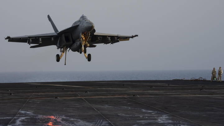A fighter jet lands on aircraft carrier USS Dwight D. Eisenhower in the Red Sea in June 2024.