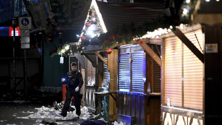 A policeman pictured at the Christmas market in Magdeburg after Friday's deadly car-ramming.