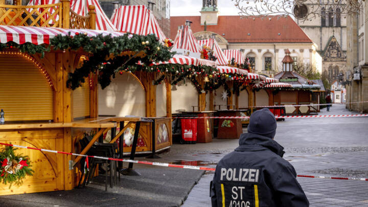 A police officer guards the site of  the Magdeburg Christmas market on December 22, 2024, days after a car ploughed into crowds, killing five people.