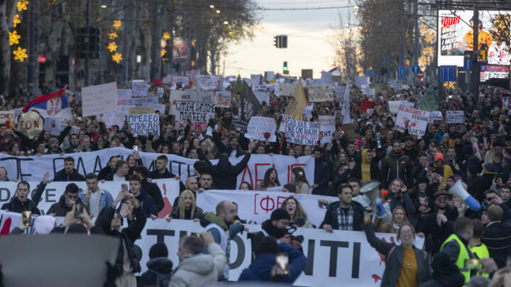 People attend a protest against President Aleksandar Vucic and his government, in central Belgrade, Serbia, Sunday, Dec. 22, 2024.
