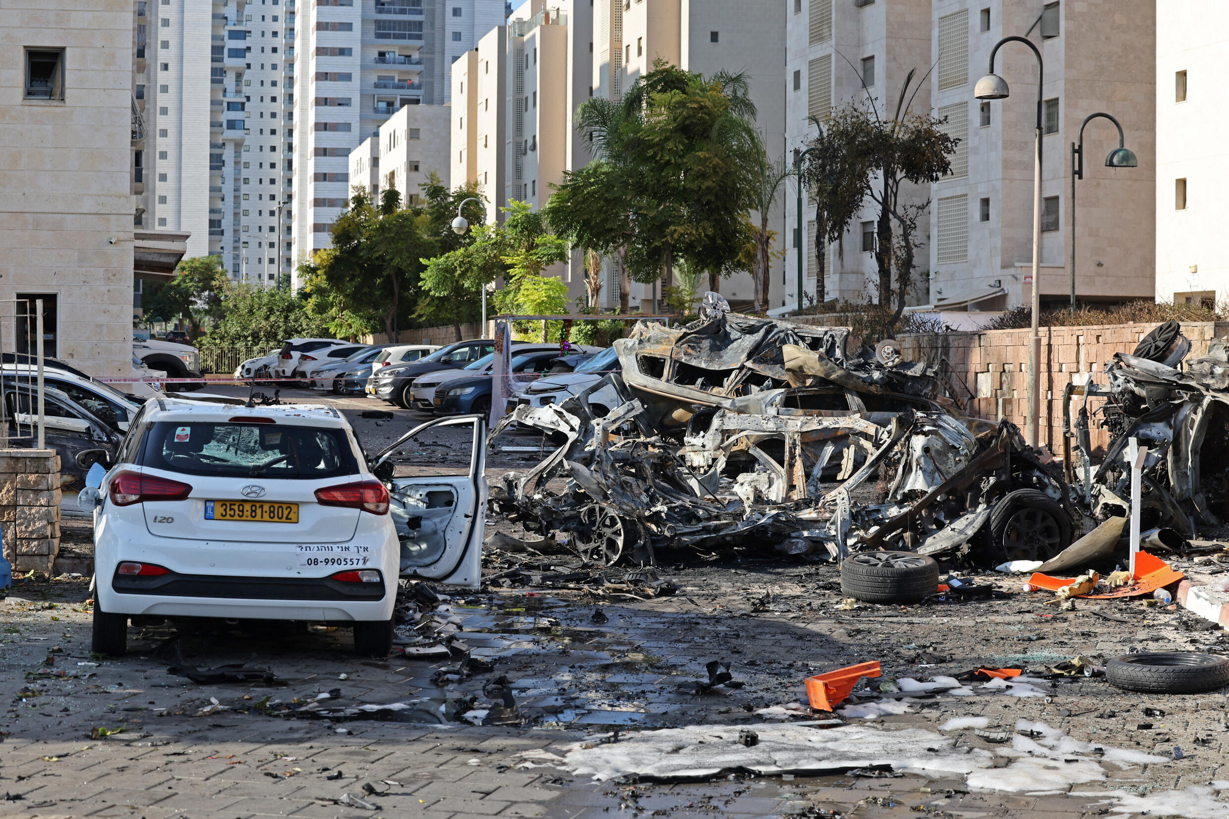 Burnt out vehicles in Ashkelon are pictured following a rocket attack from the Gaza Strip into Israel on October 7, 2023.
