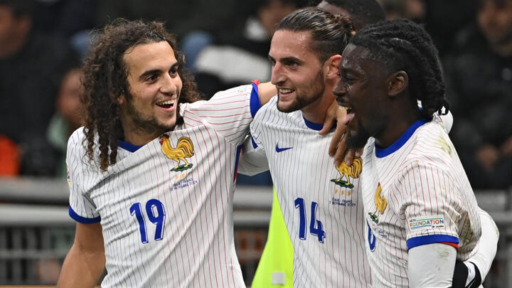 Adrien Rabiot (centre) netted twice for France against Italy on Sunday.