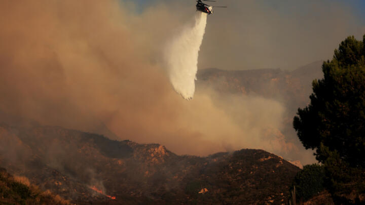 Firefighters are tackling the blaze in Malibu from the air and from the ground.