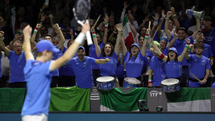 Man of the year: Italy fans celebrate with Jannik Sinner after Sunday's Davis Cup triumph.