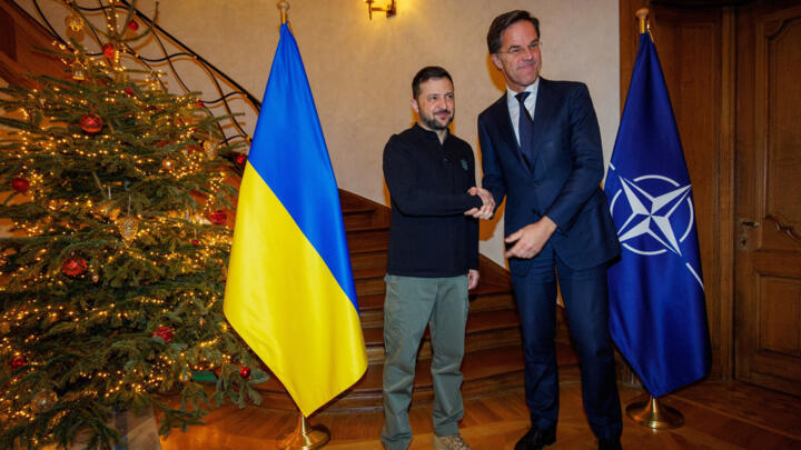 NATO Secretary General Mark Rutte and President of Ukraine Volodymyr Zelensky shake hands at the NATO Secretary General Residence, Brussels, Belgium, December 18, 2024.